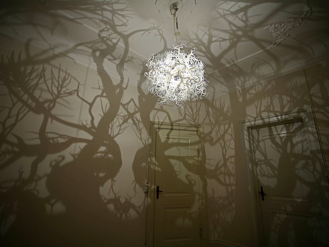 chic chandelier casting a shadow trees-01