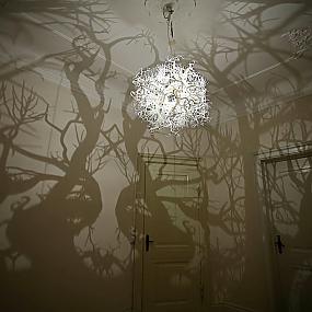 chic chandelier casting a shadow trees-01