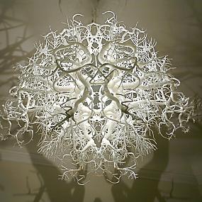 chic chandelier casting a shadow trees-02