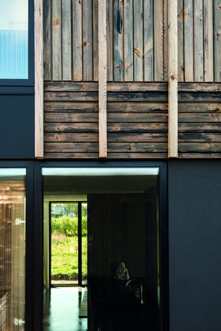Натуральное дерево в оформлении фасада дома от Henning Larsen Architects, Дания
