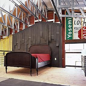 modern-bedroom-with-salvaged-metal-signs