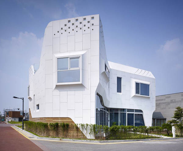 Eccentric White Residence With Square Perforations