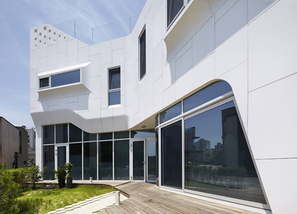 Eccentric White Residence With Square Perforations