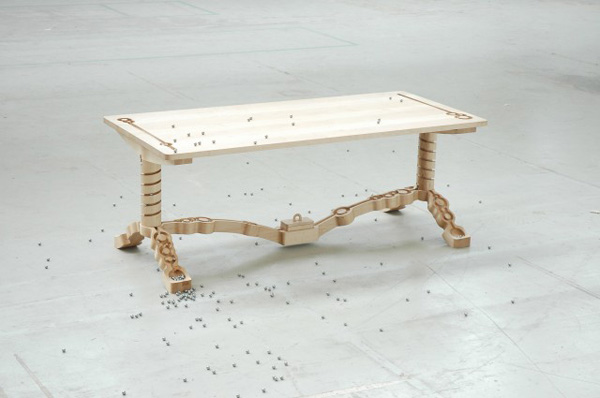 Marbelous, a wooden table with built-in marble tracks