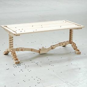 Marbelous, a wooden table with built-in marble tracks
