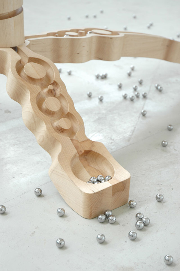 Marbelous, a wooden table with built-in marble tracks