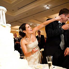 smears-cake-on-her-face-at-their-traditions-wedding-reception-01